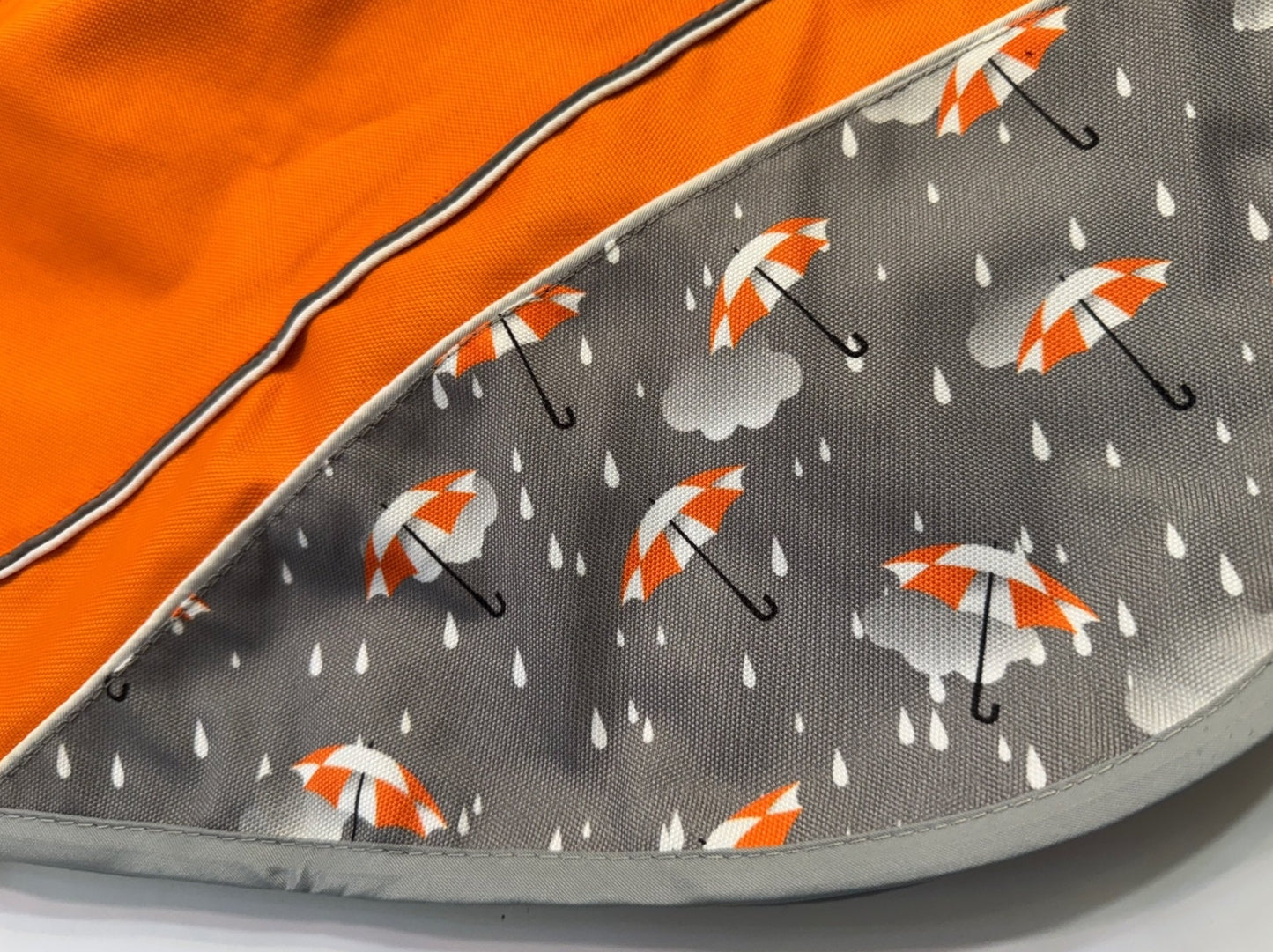 Orange umbrella print rain mac for greyhounds - the waterproof rain mac collection